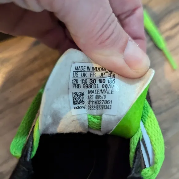 Adidas youth size 12 green and black soccer shoes. Boys size 12 soccer shoes.