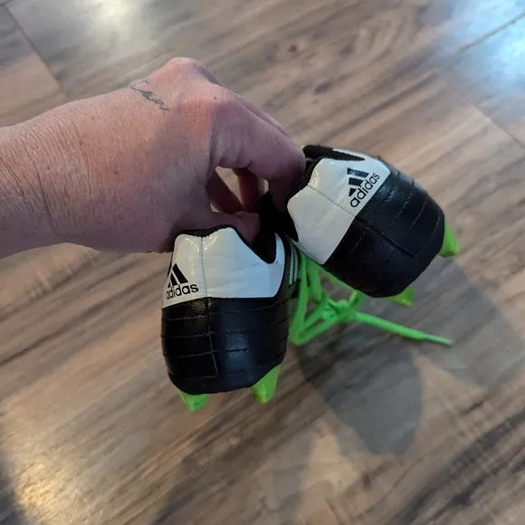 Adidas youth size 12 green and black soccer shoes. Boys size 12 soccer shoes.